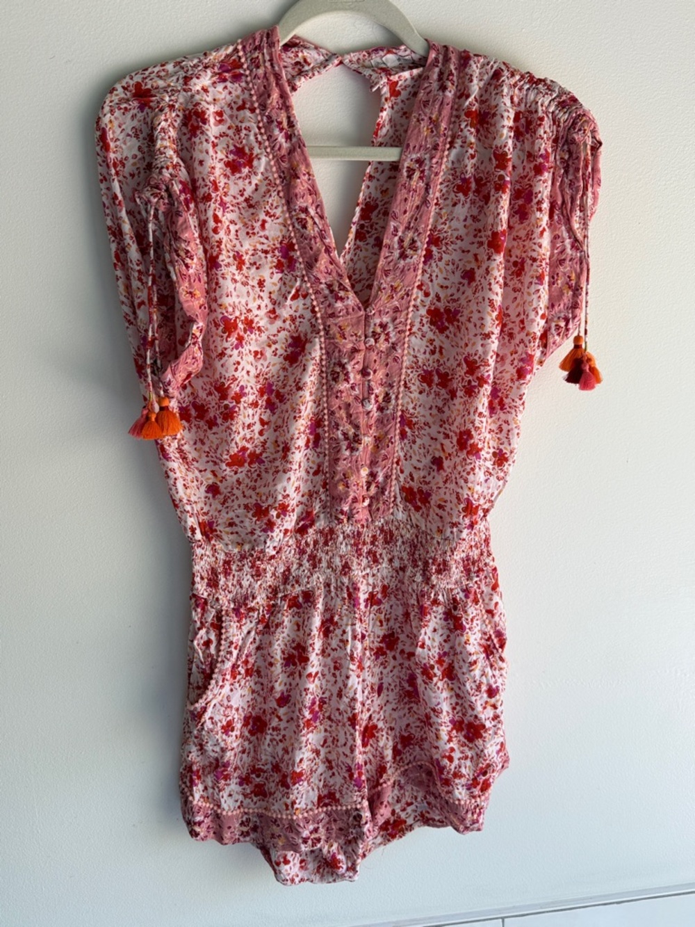 Poupette St. Barth Pink and Red Floral Romper with Orange Tassels